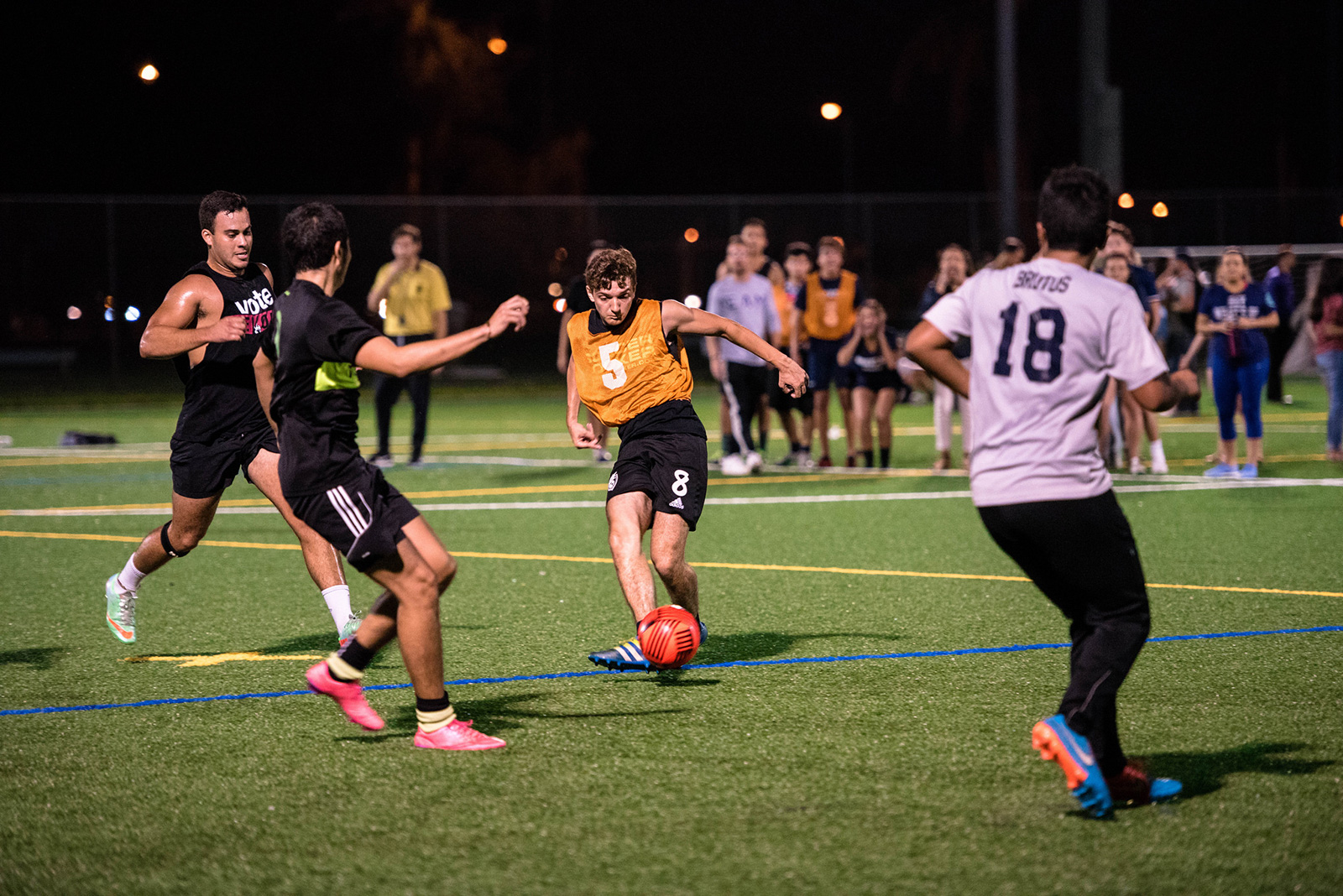 Intramural soccer players relax on a soccer field